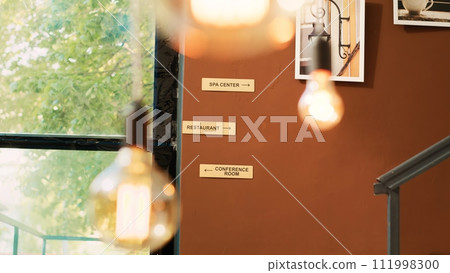 Luxury interior decor in hotel entrance, classy residential resort with interior design and furniture. Empty lounge area in lobby, modern classy decoration in front desk reception. Handheld shot. 111998300