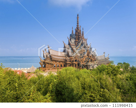 Distant view of the Sanctuary of Truth along the coast of Pattaya, Thailand / Pattaya, TH 111998415