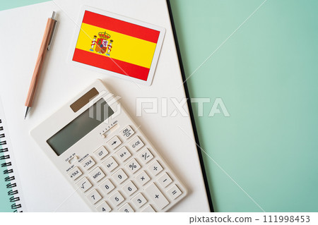 Spanish flag, calculator, notebook and pen 111998453