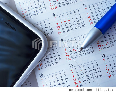 Notebook, calendar and smartphone on the table Notebook, calendar and smartphone on the table 111999105