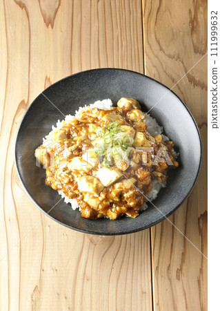 Piping hot mapo bowl topped with plenty of tofu and green onion Piping hot mapo bowl topped with plenty of tofu and green onion 111999632