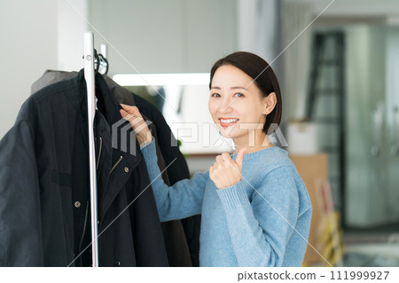 woman checking clothes 111999927