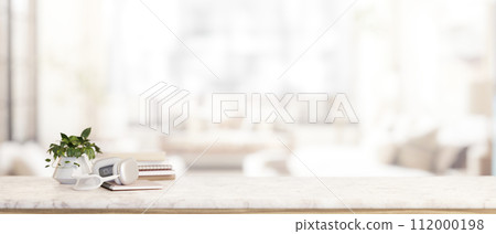 A luxury white marble tabletop with a copy space with a blurred background of a modern living room. 112000198