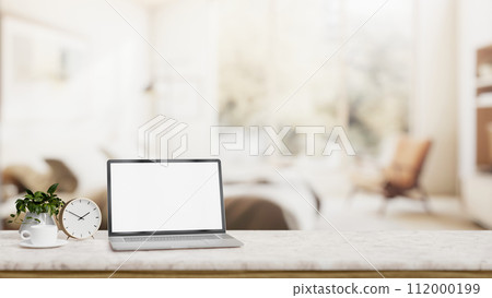 Home office, a white-screen laptop computer mockup on a table in a modern living room. 112000199