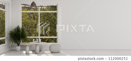 A contemporary, white living room with a coffee table, poufs, a ceiling fan, windows, and flooring. A contemporary, white living room with a coffee table, poufs, a ceiling fan, windows, and flooring. 112000251