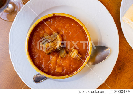 Just cooked patatas revolconas served on table 112000429