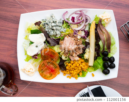 Fresh tuna salad with cheese served on table Fresh tuna salad with cheese served on table 112001156