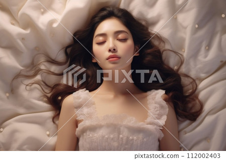 beautiful woman on the bed 112002403