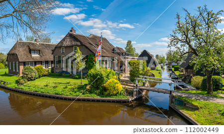 Giethoorn Netherlands, panorama city skyline at canal and traditional house in Giethoorn village Giethoorn Netherlands, panorama city skyline at canal and traditional house in Giethoorn village 112002449