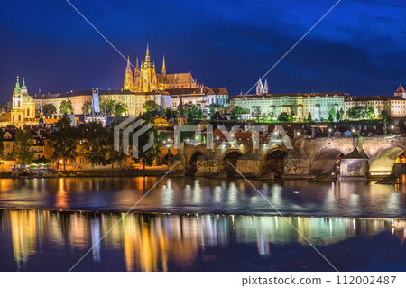 Prague Czech Republic, night city skyline at Charles Bridge Vltava River and Prague Castle, Czechia 112002487