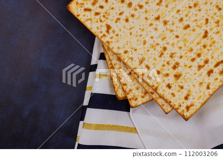 Traditional Jewish holiday celebrated with unleavened flatbread Matzah during Pesach Traditional Jewish holiday celebrated with unleavened flatbread Matzah during Pesach 112003206