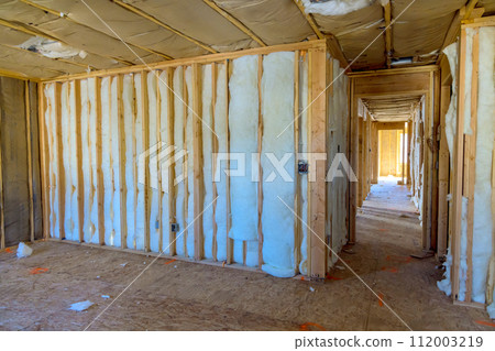 Construction of new residential home involves installation of insulation walls 112003219