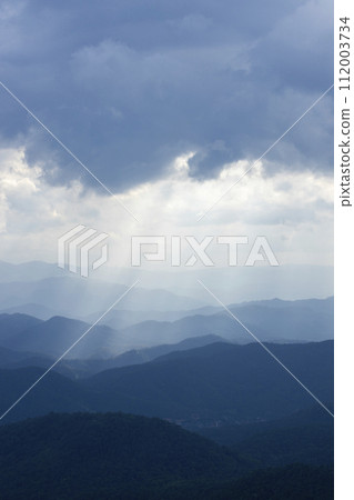 Top view Landscape of Morning Mist with Mountain Layer at north of Thailand. mountain ridge and clouds in rural jungle bush forest Top view Landscape of Morning Mist with Mountain Layer at north of Thailand. mountain ridge and clouds in rural jungle bush forest 112003734