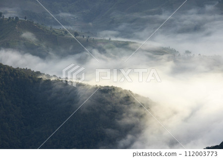 Top view Landscape of Morning Mist with Mountain Layer at north of Thailand. mountain ridge and clouds in rural jungle bush forest 112003773