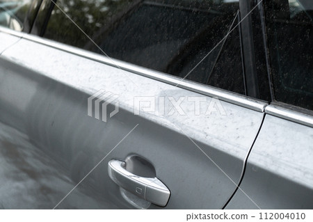 Details of dirty car before washing luxury silver car on touchless car wash. Cleaning the details of car. Cleanliness environment Details of dirty car before washing luxury silver car on touchless car wash. Cleaning the details of car. Cleanliness environment 112004010