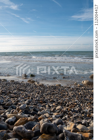 Pebbled Shoreline and the Whispering Waves 112004417