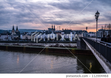 Sunset colorfull sunrise in Koblenz, Germany view of Old Town at the Mosel river shoreline Sunset colorfull sunrise in Koblenz, Germany view of Old Town at the Mosel river shoreline 112004468
