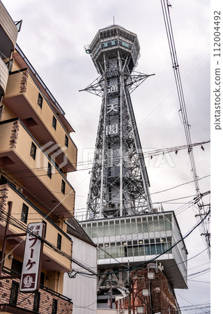 Tsutenkaku tower famous landmark in the Shinsekai district of Osaka, Japan 112004492