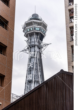 Tsutenkaku tower famous landmark in the Shinsekai district of Osaka, Japan 112004493