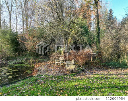 Enlgish green garden with water pound and multpiple type of trees and plants Enlgish green garden with water pound and multpiple type of trees and plants 112004964