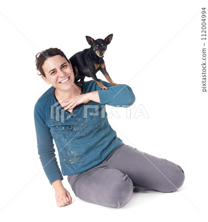 miniature pinscher and woman in studio miniature pinscher and woman in studio 112004994