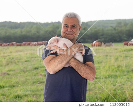 young pig and man 112005015