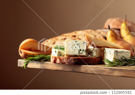 Sandwich with blue cheese, pears, and rosemary. 112005581