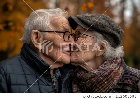 Affectionate senior couple kissing each other 112006595