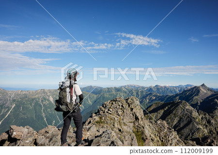 A woman climbing Okuhotaka 112009199