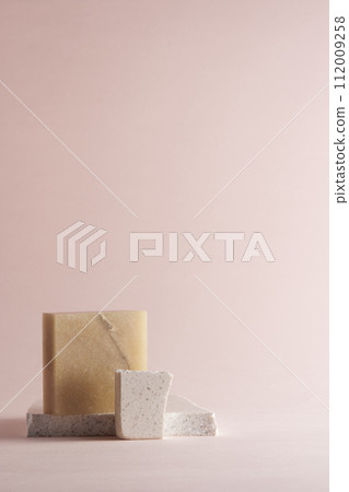 Pastel toned background with broken stones and natural objects. 112009258