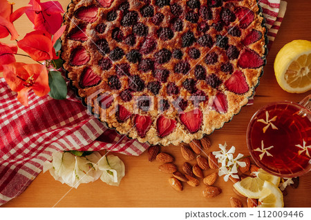 Homemade berry tart with Frangipane cream on the table  112009446