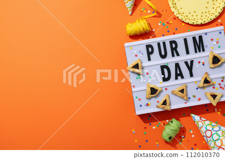 The concept of the holiday Purim, with traditional symbols. 112010370