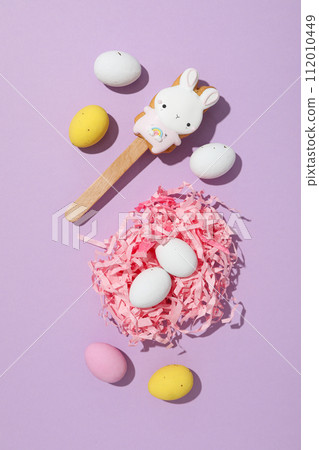 Chocolate eggs in a decorative nest with gifts Chocolate eggs in a decorative nest with gifts 112010449