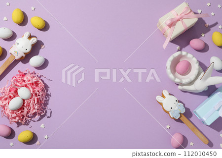 Chocolate eggs in a decorative nest with gifts Chocolate eggs in a decorative nest with gifts 112010450