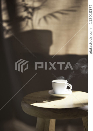 Background with shadows shining through a window with sunlight streaming in. 112010575