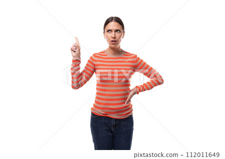 pretty young brunette woman dressed in tight orange sweater draws attention pretty young brunette woman dressed in tight orange sweater draws attention 112011649