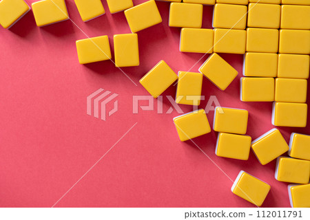 Blocks lined up on a red background 112011791