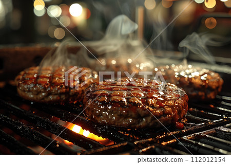 Delicious grilled hamburger on barbecue grill, closeup. Space for text 112012154
