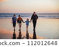 Portrait silhouettes of three children and dad happy kids with father on beach at sunset. happy family, Man, two school boys and one little preschool girl. Siblings having fun together. Bonding 112012648
