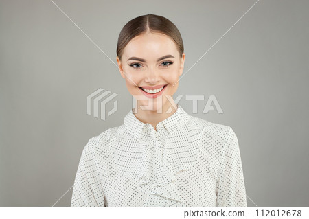 Happy smiling woman looking at camera on white background Happy smiling woman looking at camera on white background 112012678