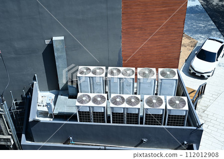 Aerial view of Air conditioner units (HVAC) installed on the roof of the building 112012908