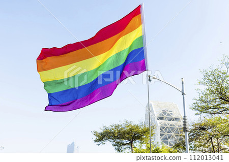 Close-up of a six-band rainbow flag with the blue sky background in Kaohsiung, Taiwan. Close-up of a six-band rainbow flag with the blue sky background in Kaohsiung, Taiwan. 112013041