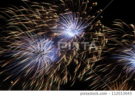 Close-up of colorful fireworks on a black background. 112013043