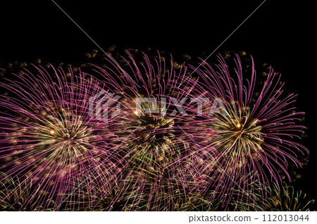 Close-up of colorful fireworks on a black background. 112013044