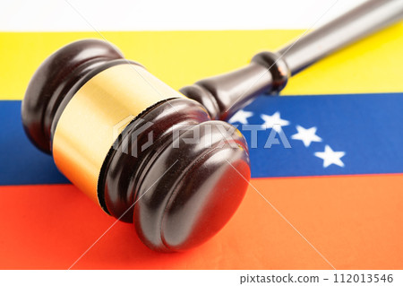 Venezuela flag with judge hammer, Law and justice court concept. Venezuela flag with judge hammer, Law and justice court concept. 112013546