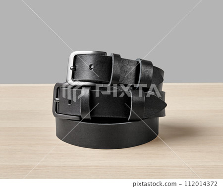 Two folded black leather belts with bespoke DAD embossing Two folded black leather belts with bespoke DAD embossing 112014372