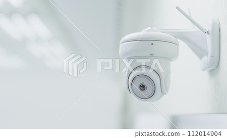Cctv Security Camera Installed in white room or laboratory. Can be used in technology background or security work. Cctv Security Camera Installed in white room or laboratory. Can be used in technology background or security work. 112014904