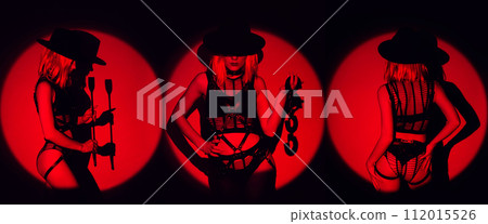 Sexy submissive woman girl in underwear with handcuffs and a flogger whip for BDSM sex with submission and domination 112015526