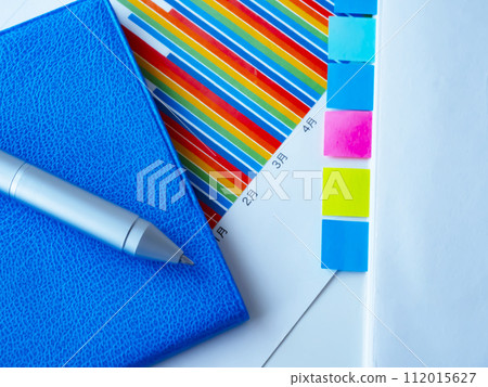 Graphs and notebooks on the table Graphs and notebooks on the table 112015627