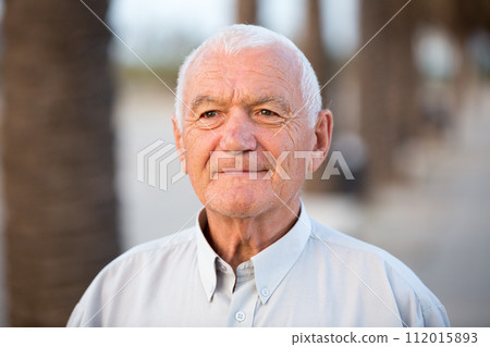 Portrait mature man in the park 112015893